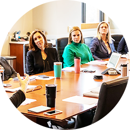 A group of people sitting at a table.
